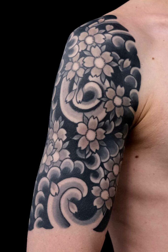 cherry blossom half sleeve on a guy as Japan tattoo and more japanese tattoos in berlin