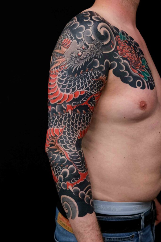 japanese dragon and chrysanthemum tattoo project of the size of a full sleeve and chest