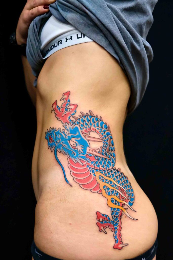 japanese dragon tattoo on the ribs of a girl done at good old times tattoo shop in berlin