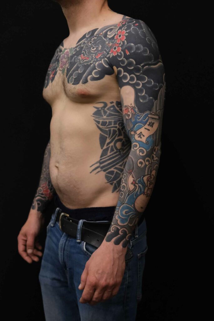 side view of japanese tattoo project of the 7 lucky gods with hotei and Fukurokuju