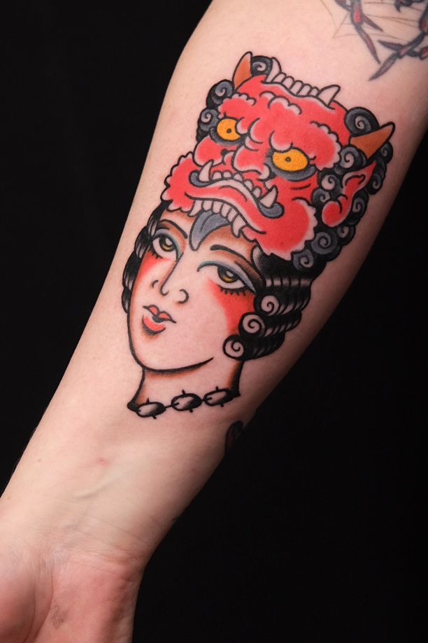woman and oni as traditional tattoo in central berlin