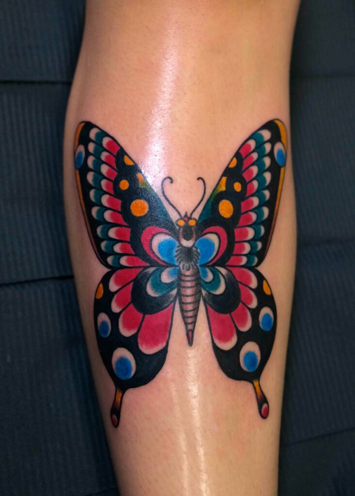 fresh traditional big butterfly tattoo in shin