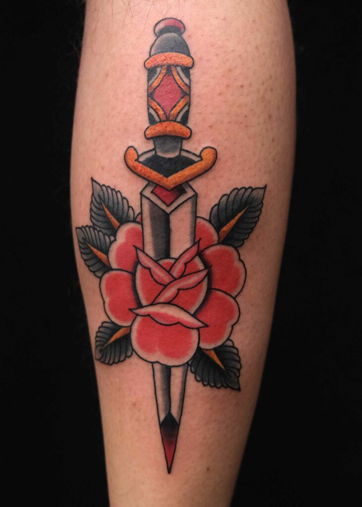 traditional rose and dagger by Swen Losinsky at good old times tattoo berlin