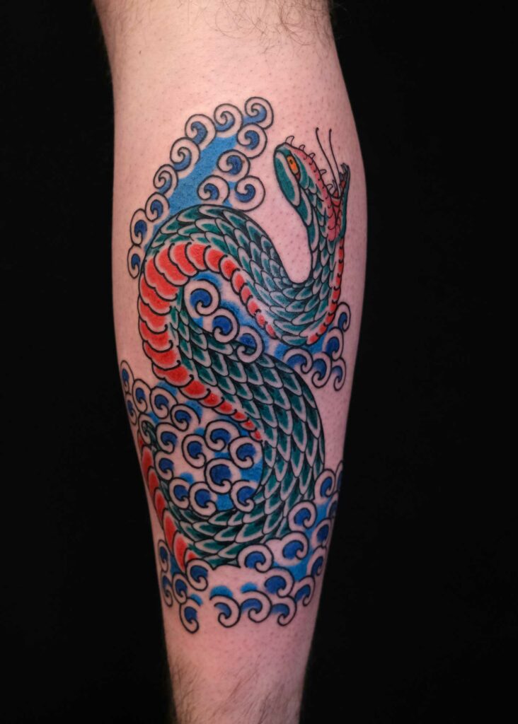 japanese snake as inspiration for custom walk in tattoo at good old times berlin