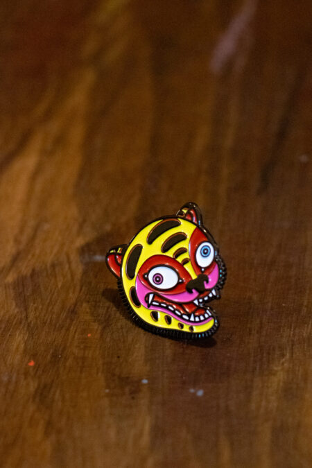 enamel pin featuring a crazy tiger front view2