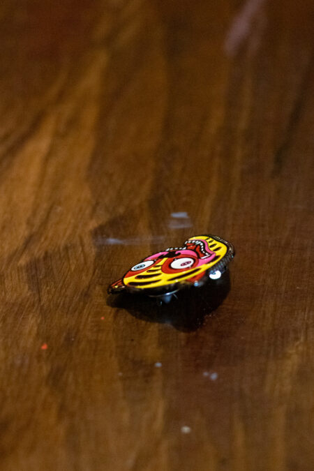 enamel pin featuring a crazy tiger side view