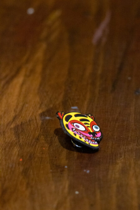 enamel pin featuring a crazy tiger side view 2