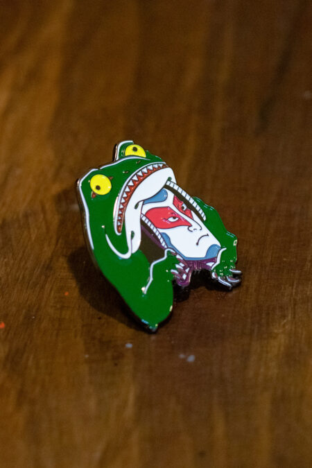 enamel pin featuring a kabuki frog side view 3